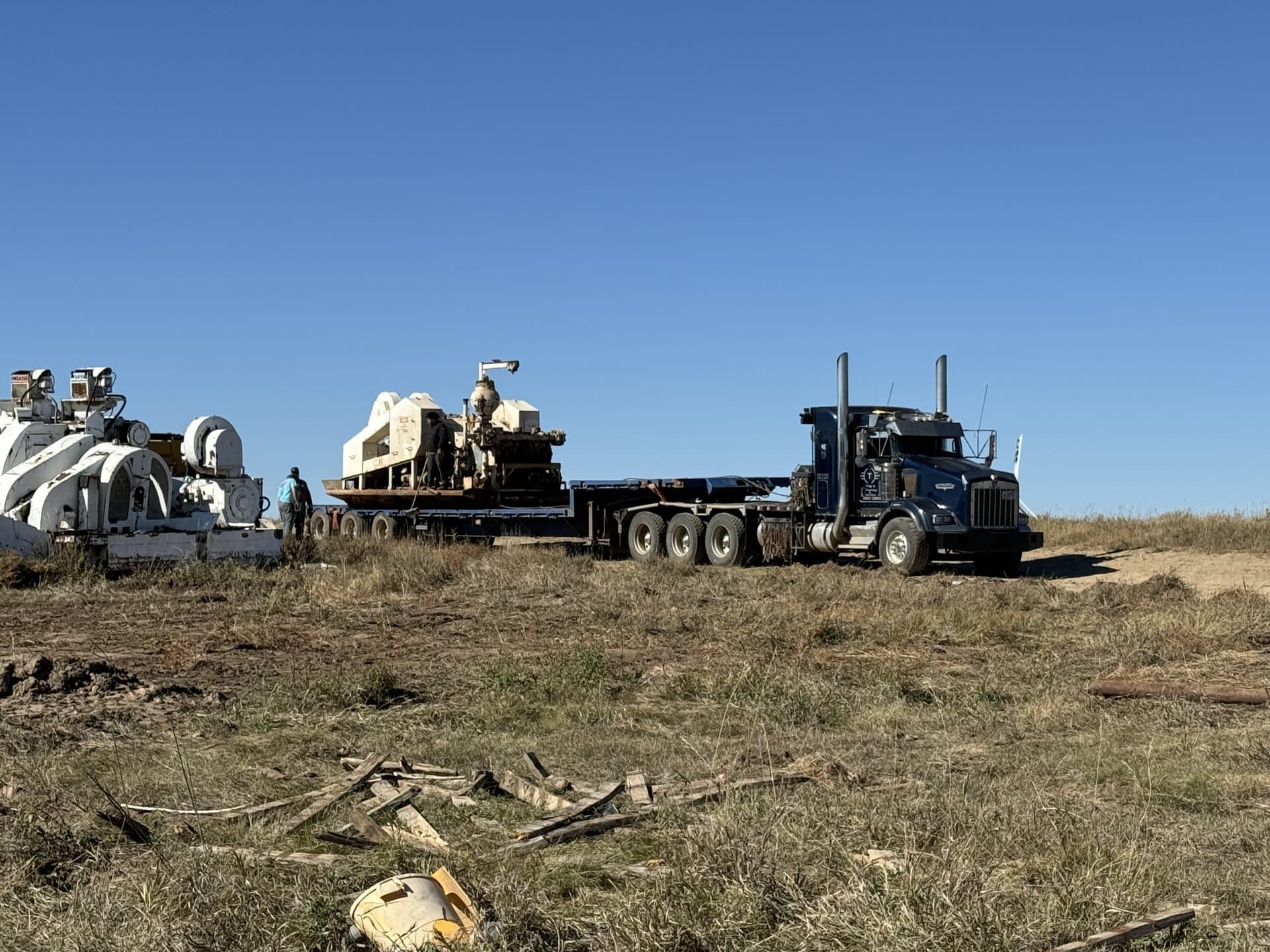 Crew working with heavy equipment in the field