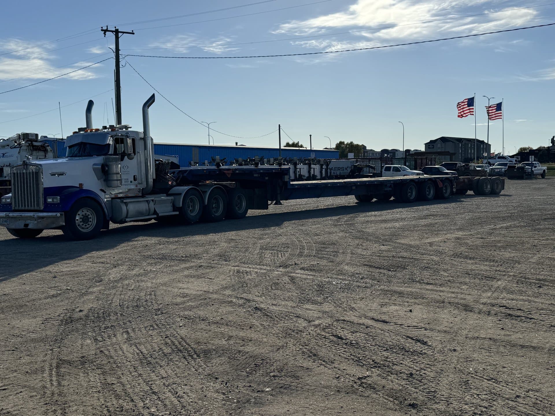Tripp In Trucking fleet with American flags